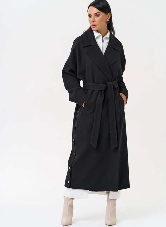 Женское пальто черного цвета с функциональными кнопками фото